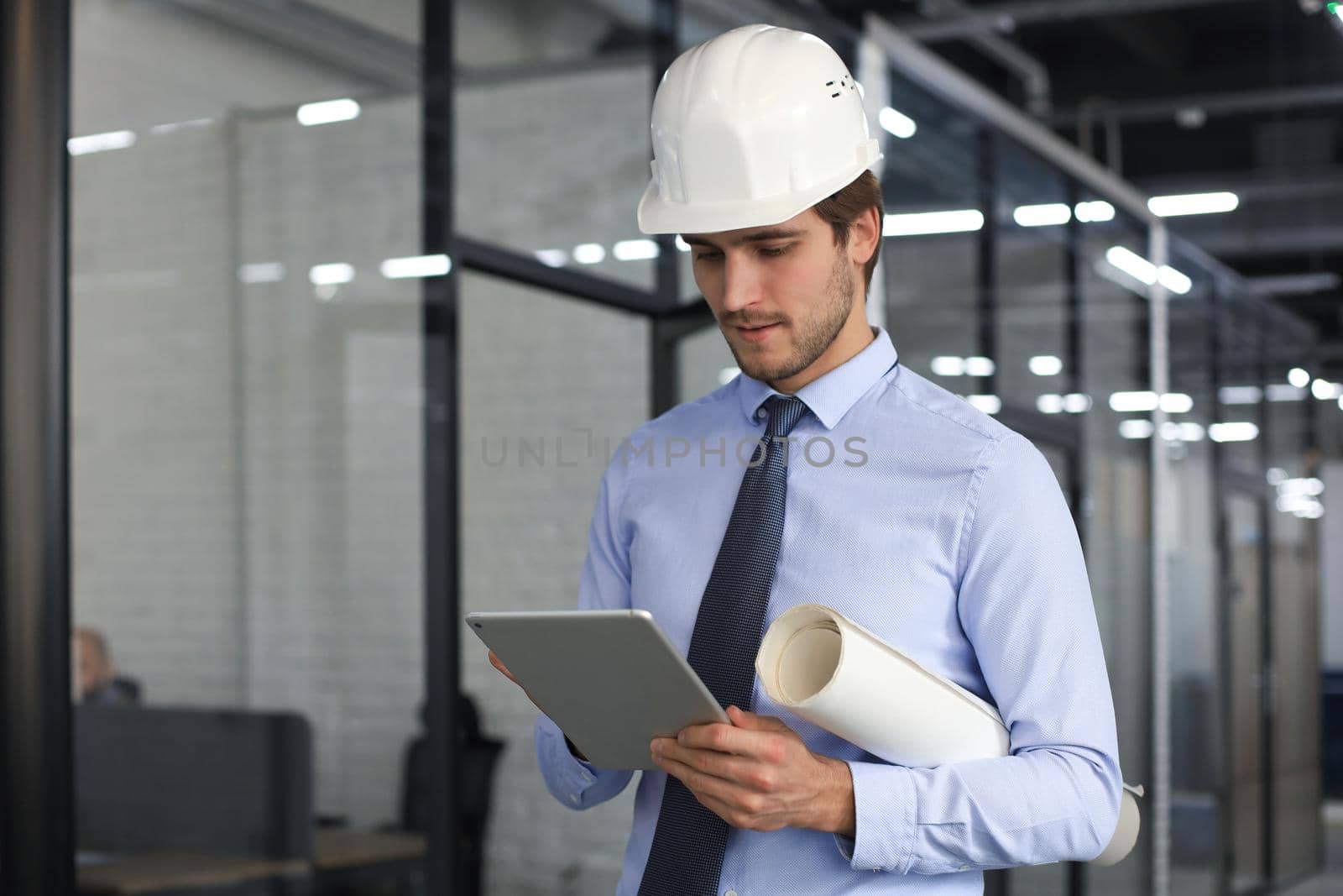 Shot of a engineer using a digital tablet on a construction site