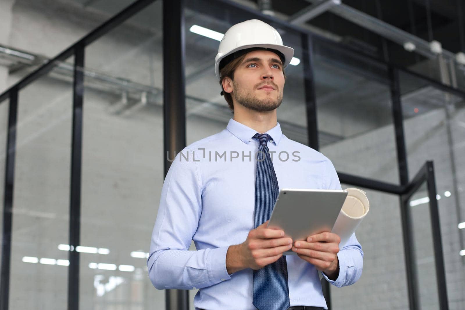 Shot of a engineer using a digital tablet on a construction site