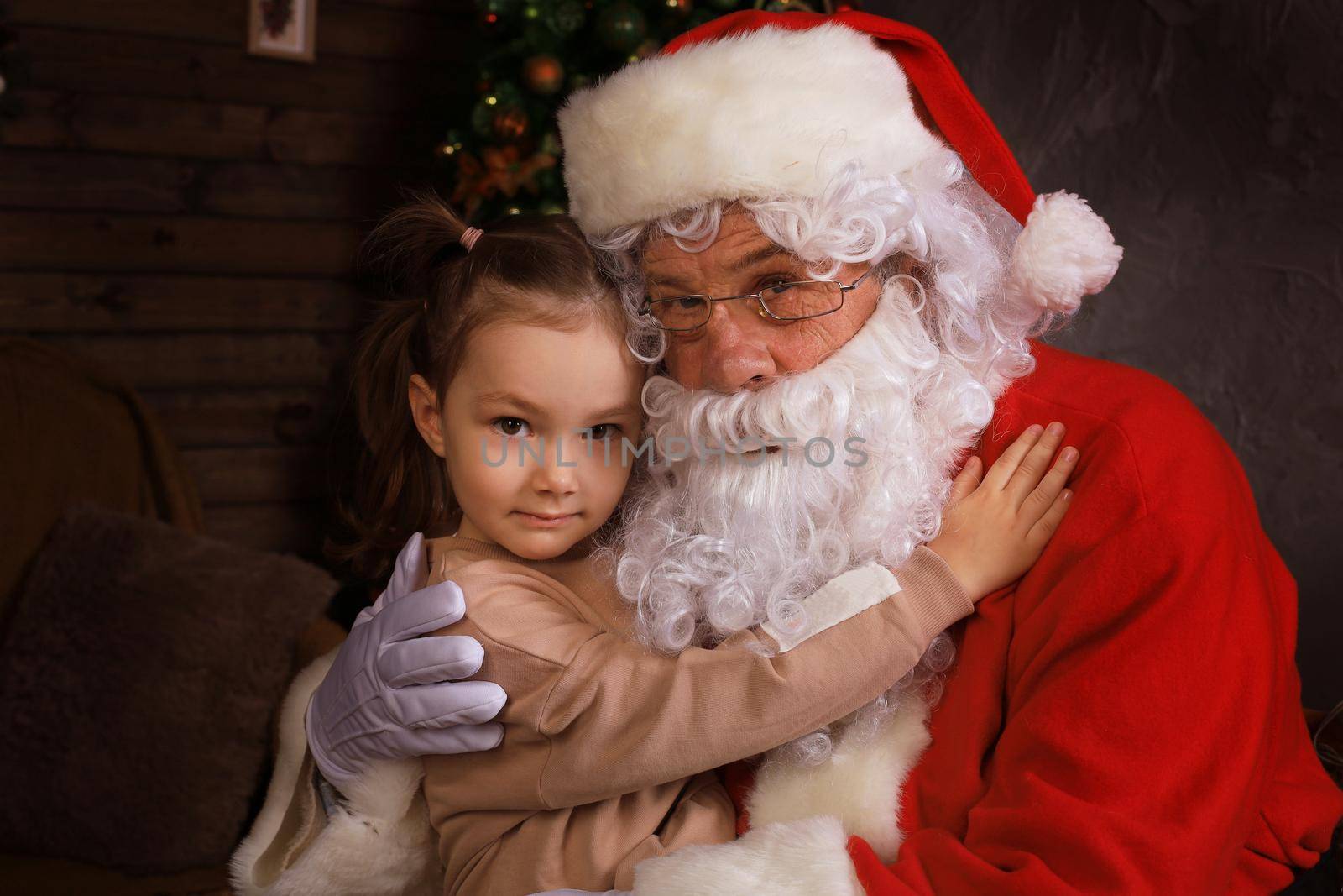 Santa Claus and child at home. Christmas gift. Family holiday concept