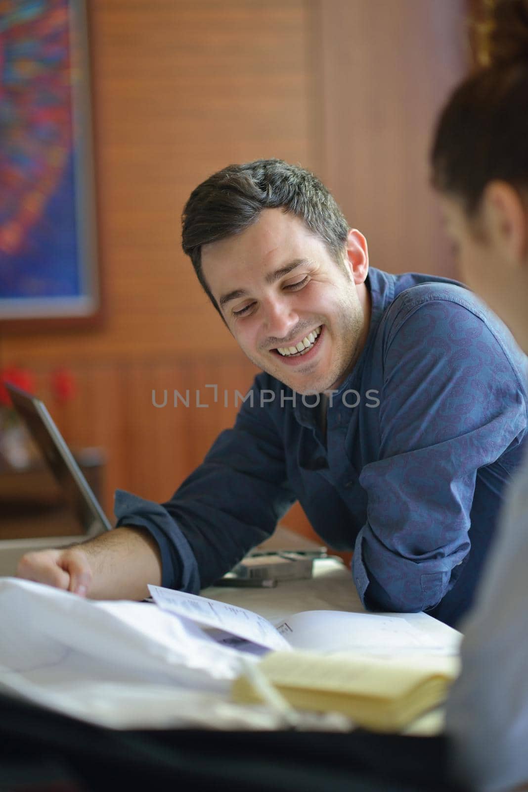 young businessman on business meeting discussing ideas at  office while working on laptop