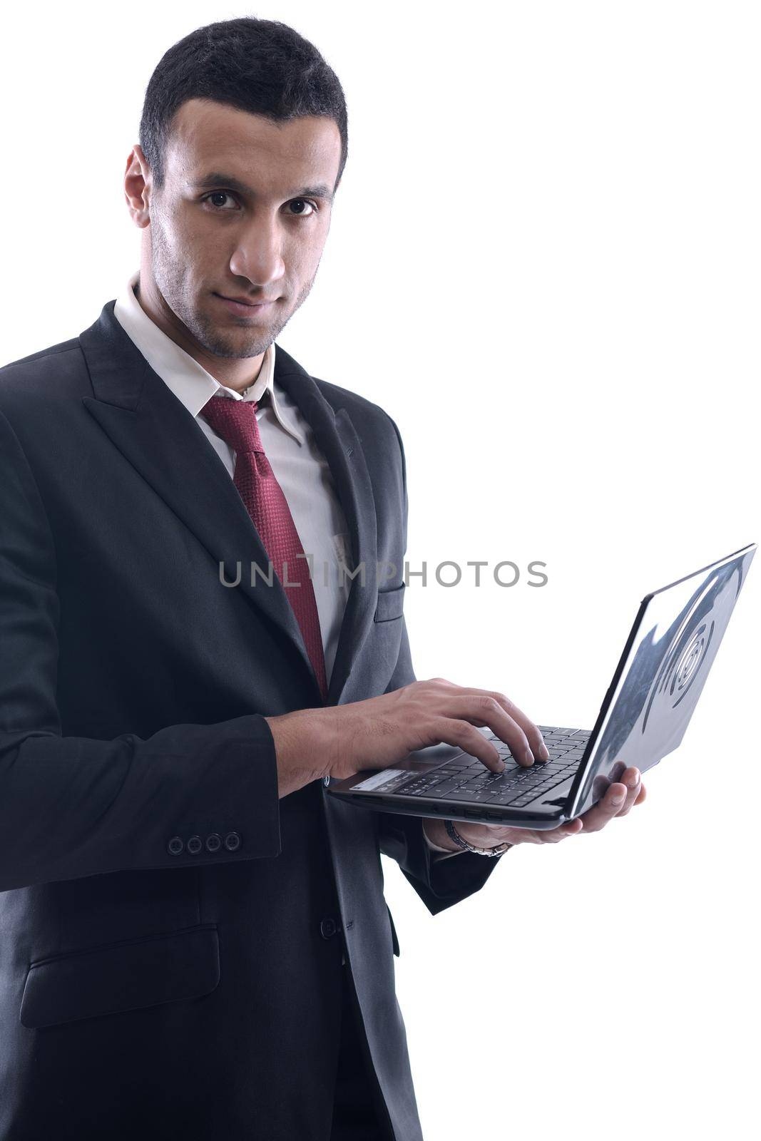 Smiling business man hold and work on mini laptop comuter   Isolated on white background in studio