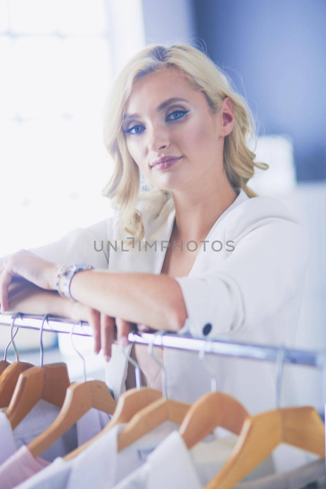 Fashion designer woman working on her designs in the studio
