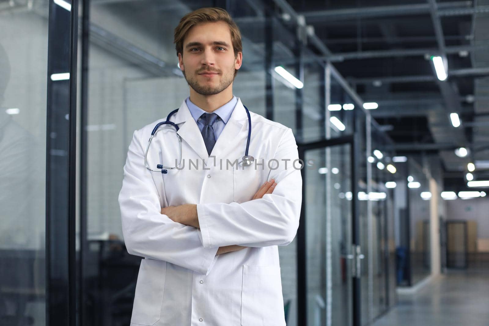 Portrait of young male doctor with stethoscope, close up