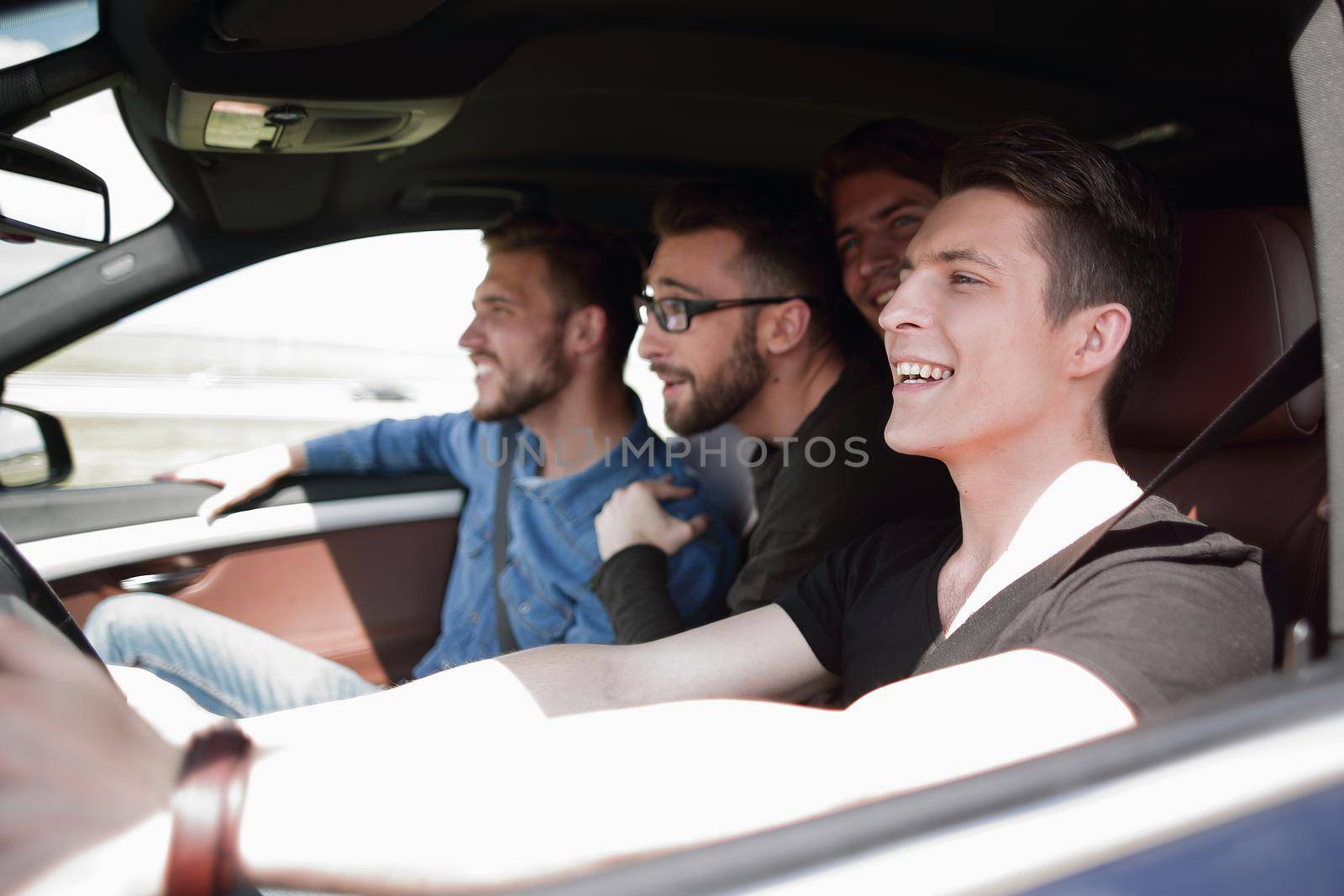 a group of boys rides and looks directly at the car by asdf