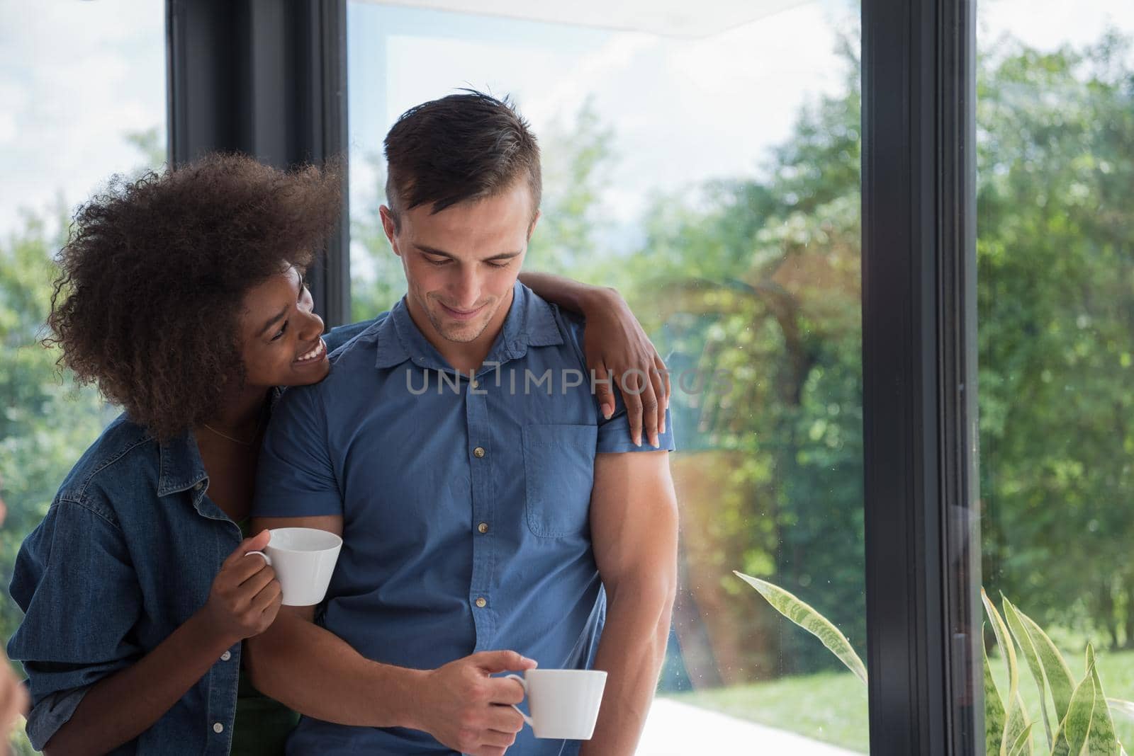 romantic happy young couple relax at modern home indoors by dotshock