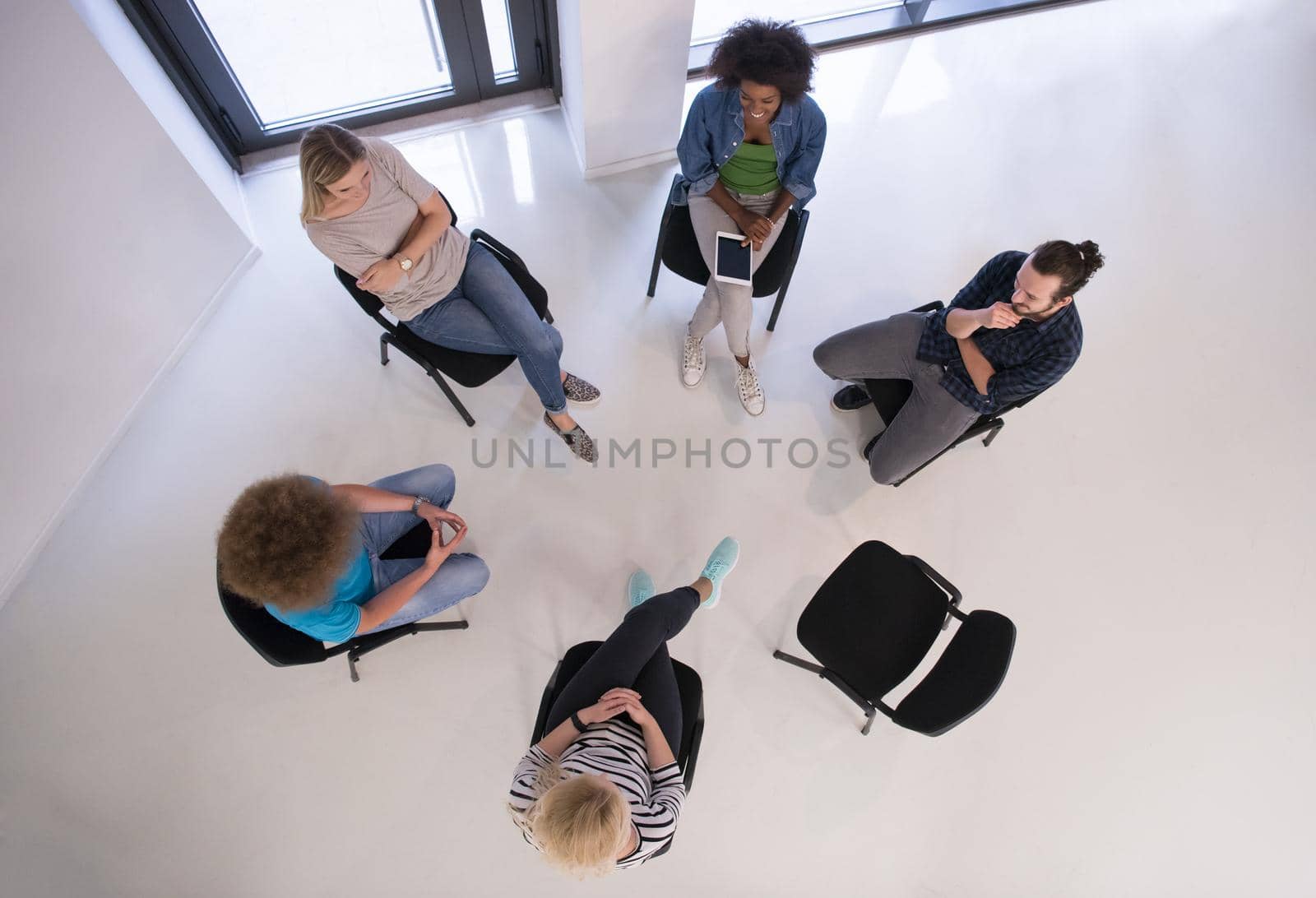 Multiethnic startup business team on meeting  top view by dotshock