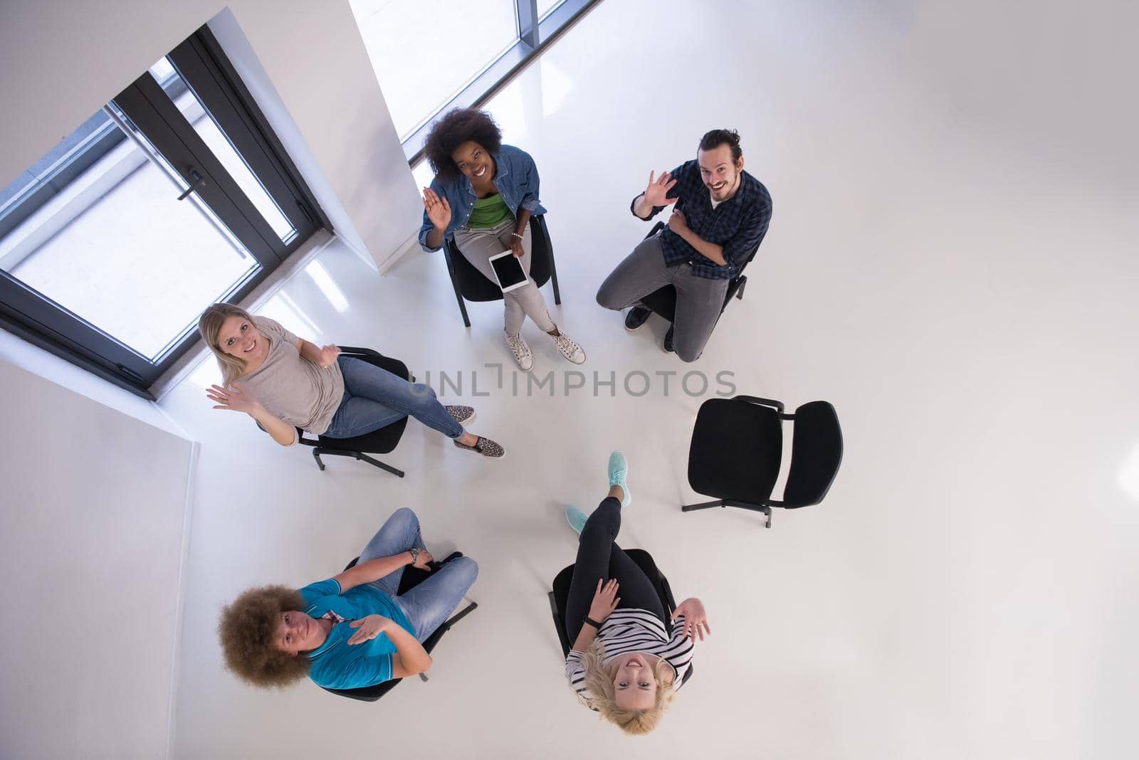 Multiethnic startup business team on meeting  top view by dotshock