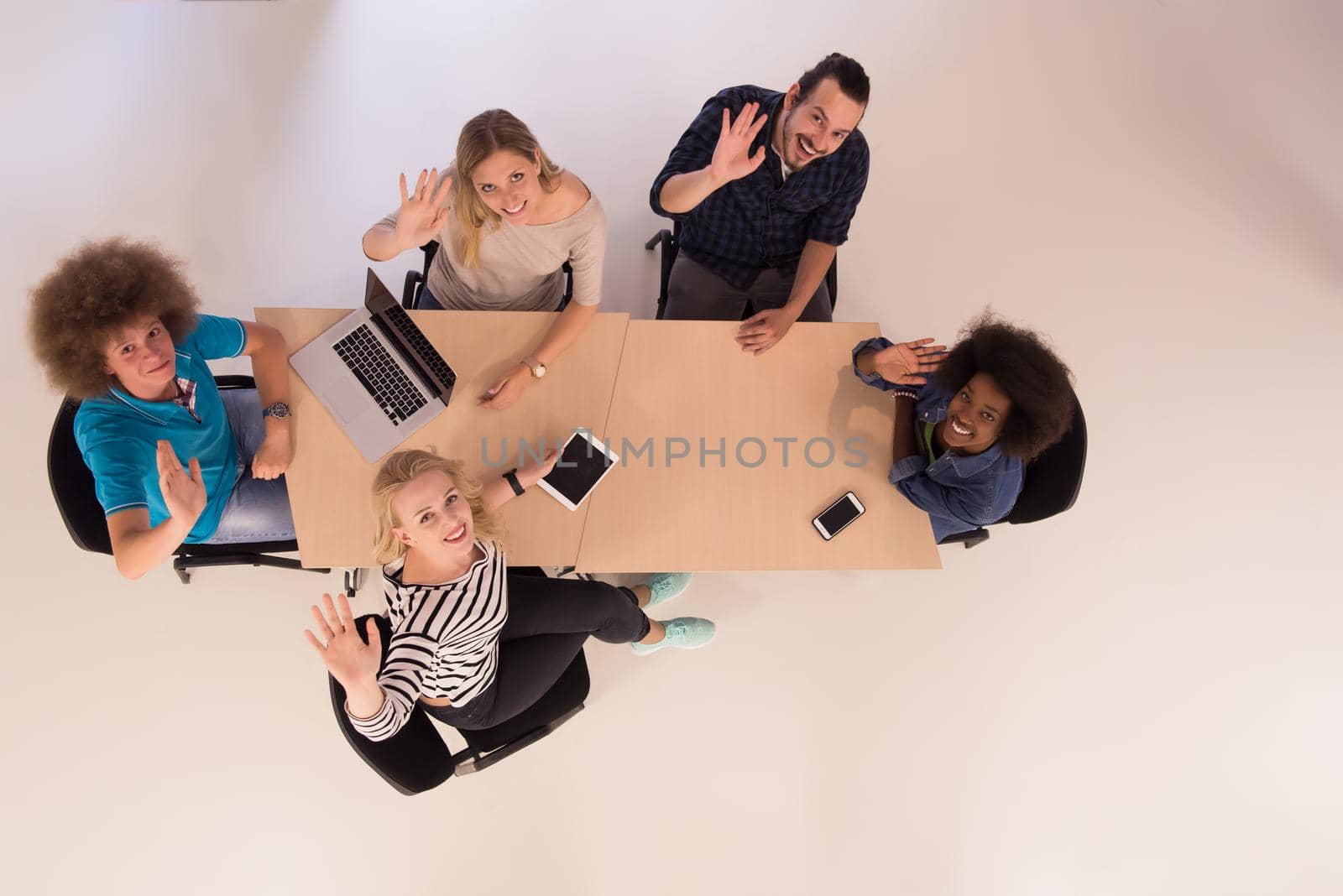 Multiethnic startup business team on meeting  top view by dotshock