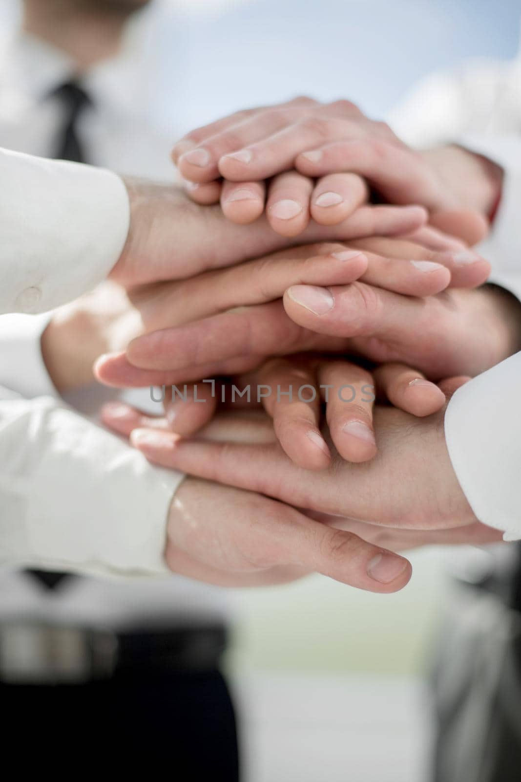 close up.business team with a stack of their hands .the concept of teamwork