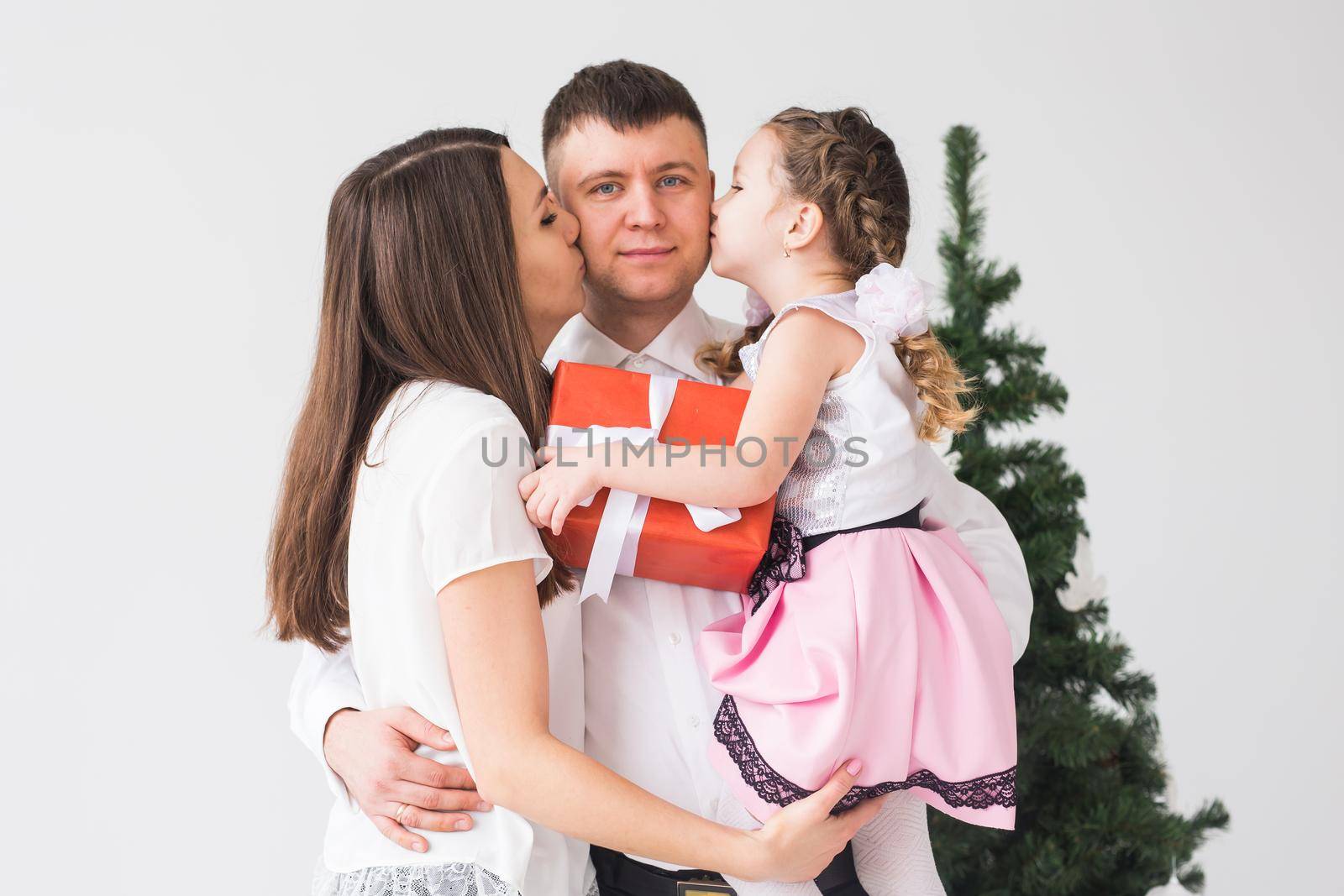 Children, festive and holidays concept - Christmas family portrait in home holiday living room.
