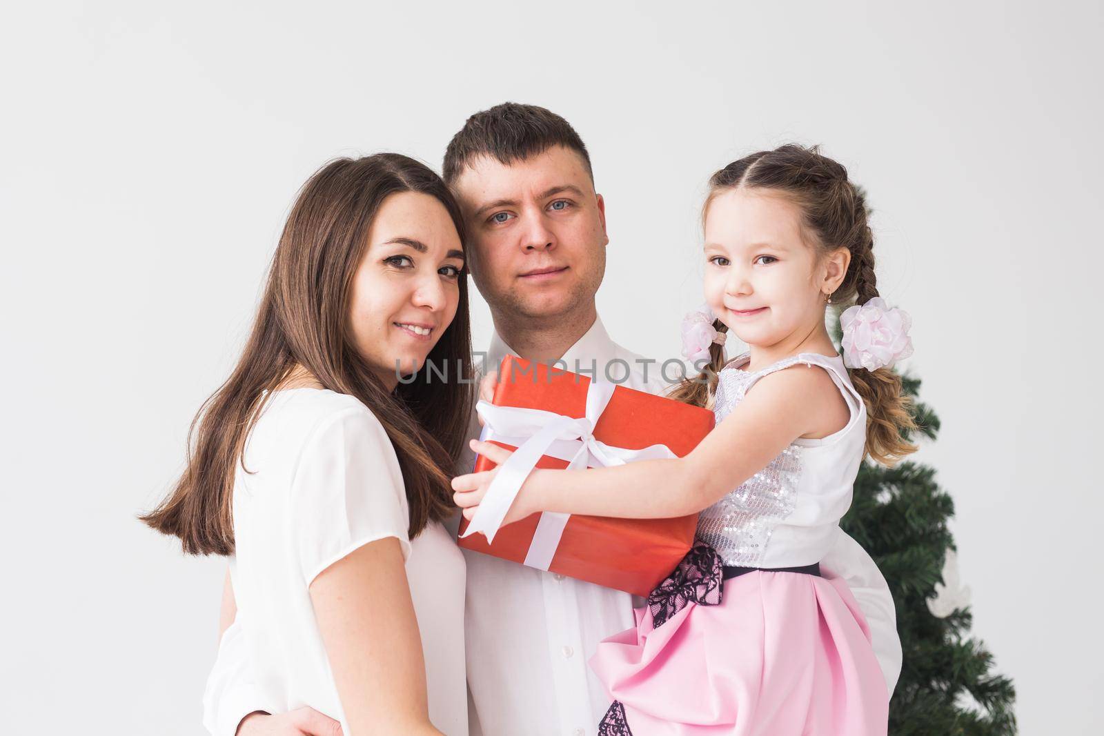Children, festive and holidays concept - Christmas family portrait in home holiday living room.
