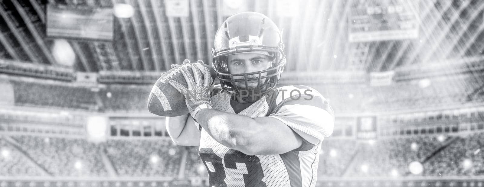 one quarterback american football player throwing ball isolated on big modern stadium field with lights and flares