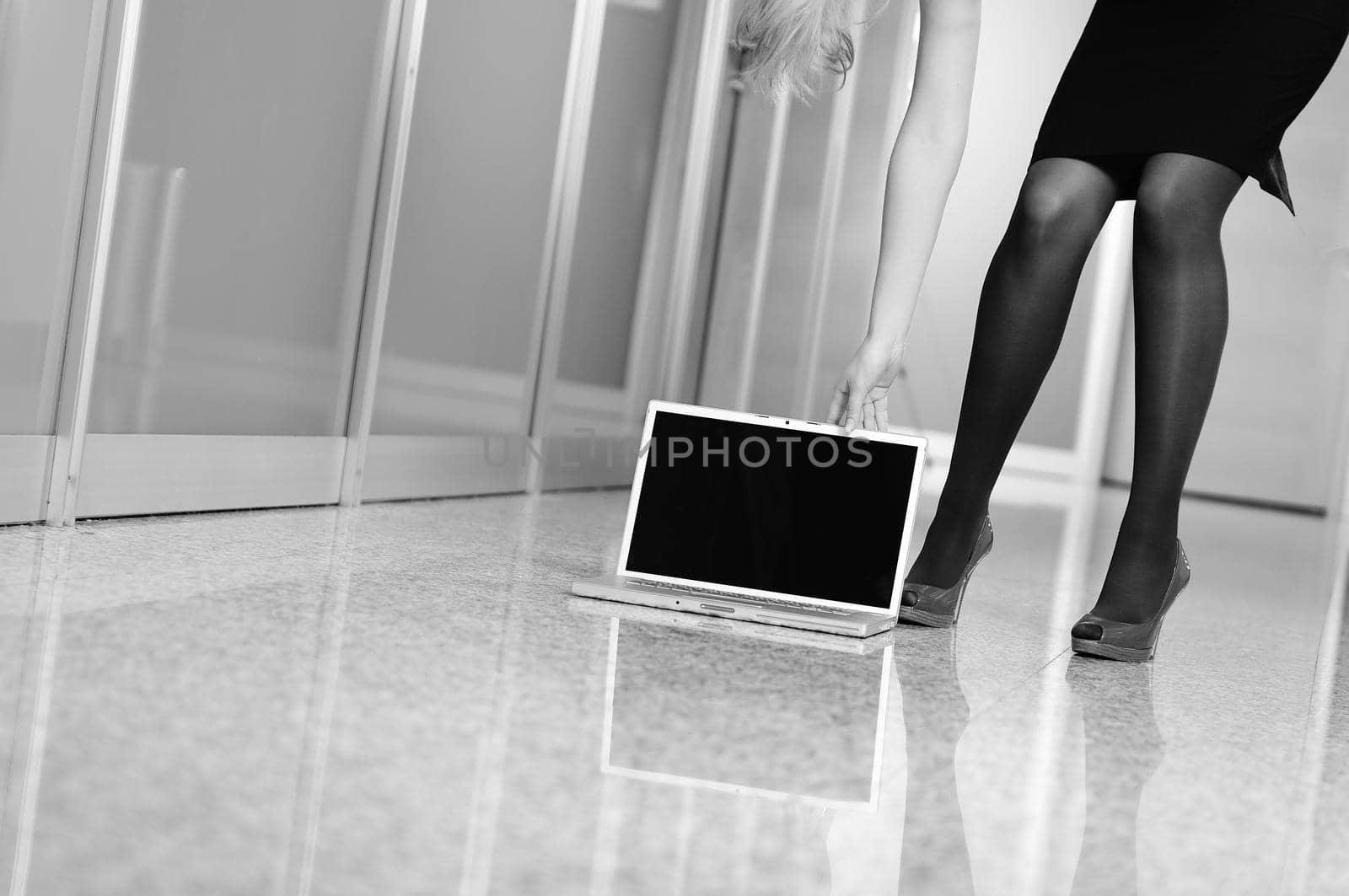 business woman stand with shoe on  laptop by dotshock