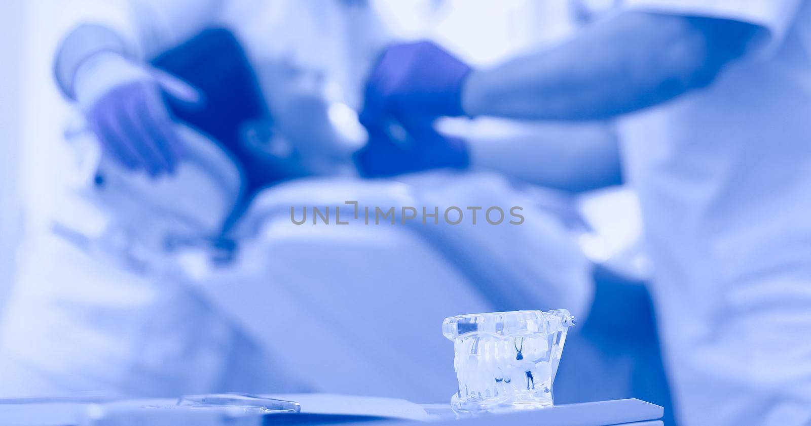 Dentist man with patient woman in clinic.