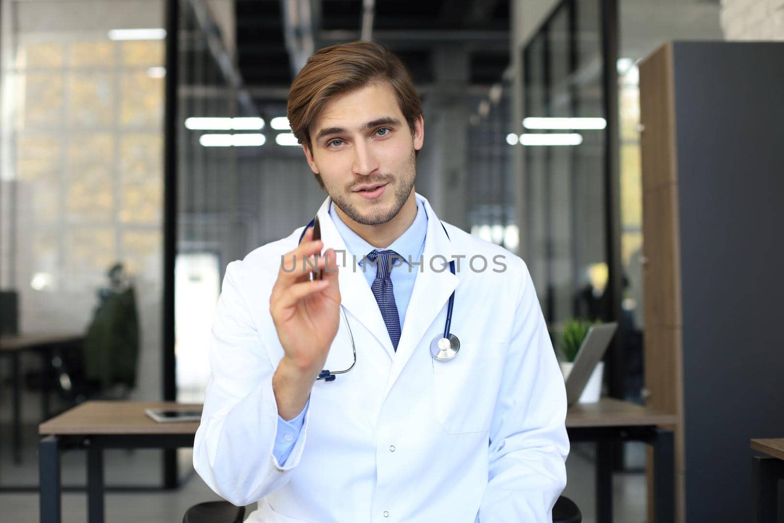 Portrait of young male doctor with stethoscope, close up