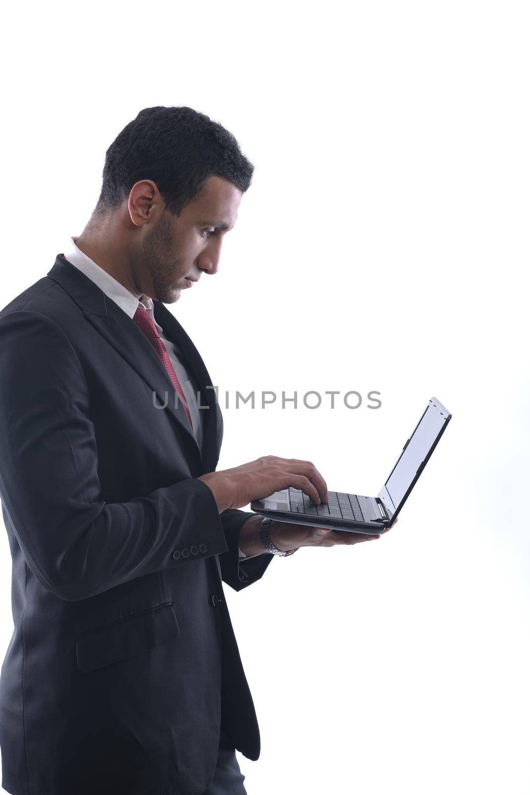 business man work on mini laptop by dotshock
