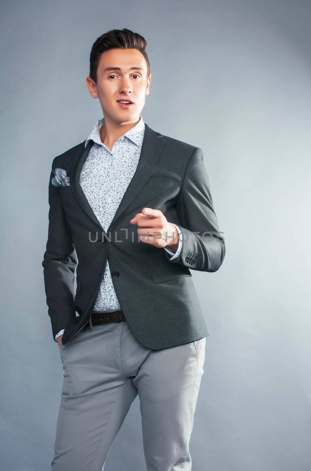 young pretty businessman posing emotional gesturing on white background, lifestyle people concept by JordanJ