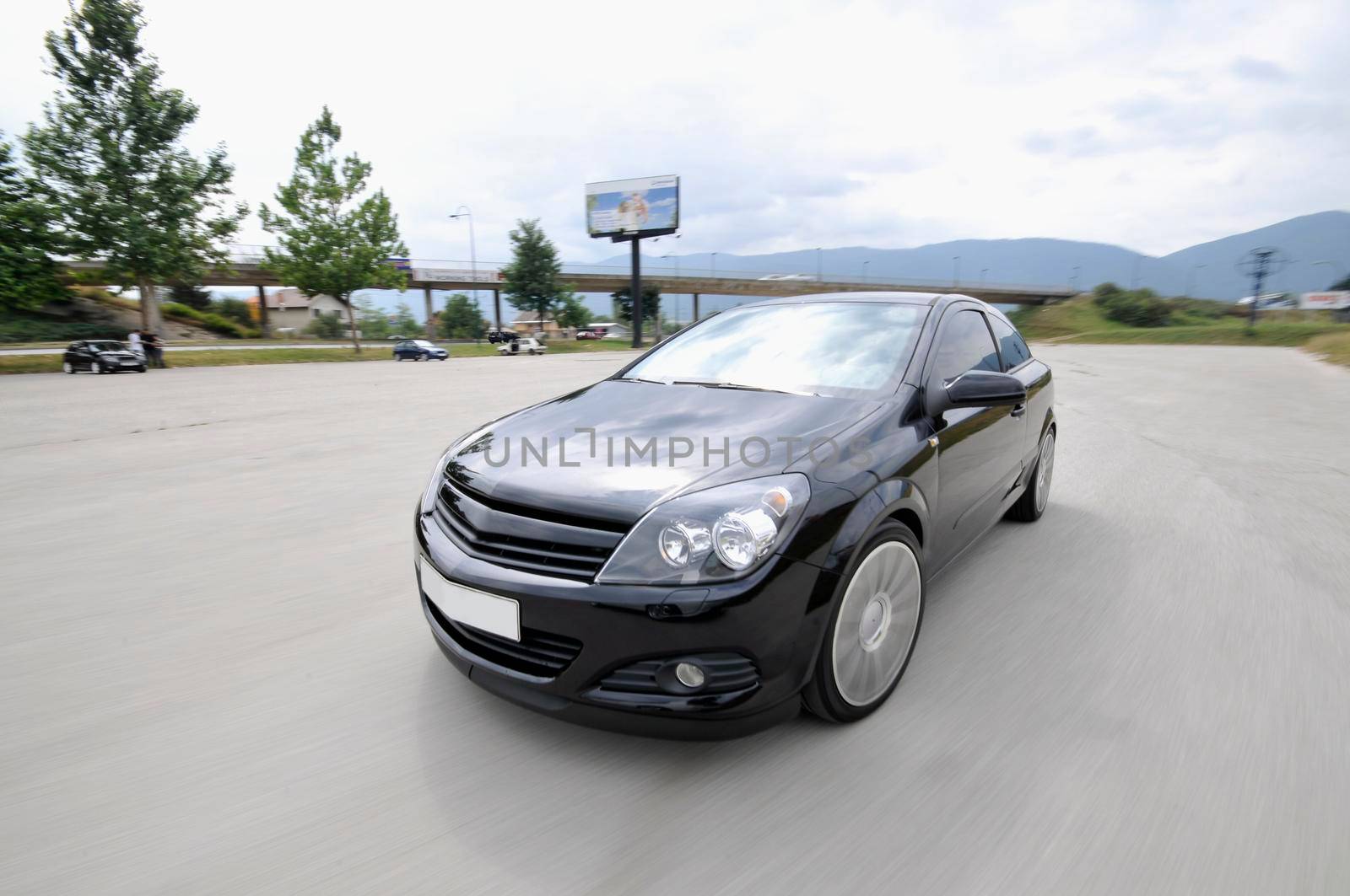 Fast car moving with motion blur by dotshock