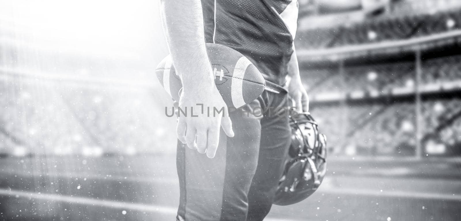 closeup American Football Player isolated on big modern stadium by dotshock