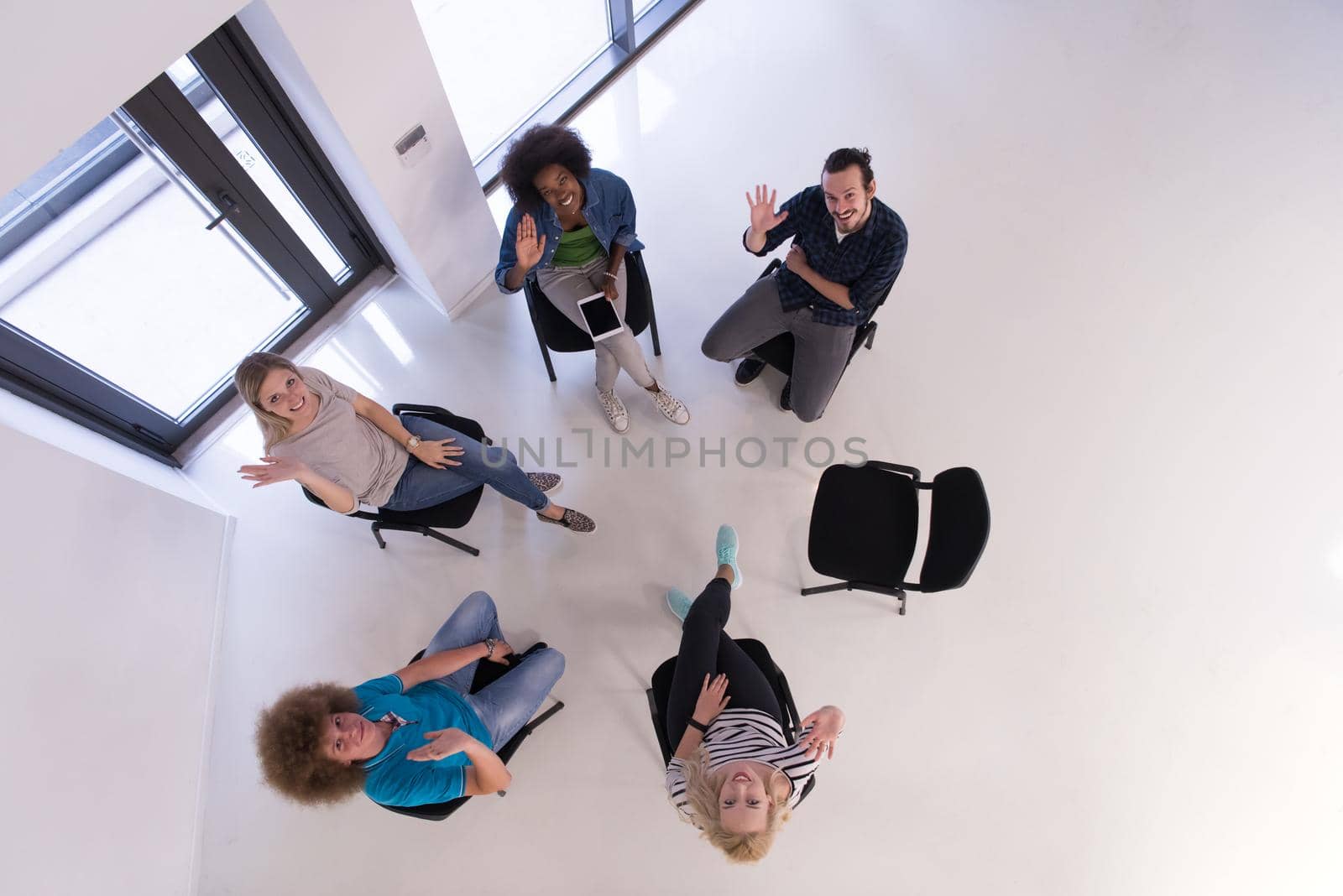 Multiethnic startup business team on meeting  top view by dotshock