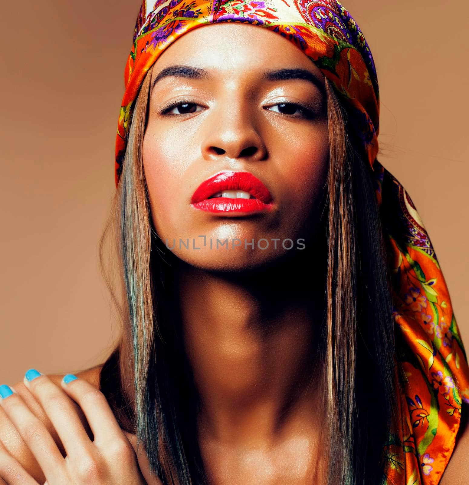 beauty bright real african woman with creative make up, shawl on head like cubian close up smiling