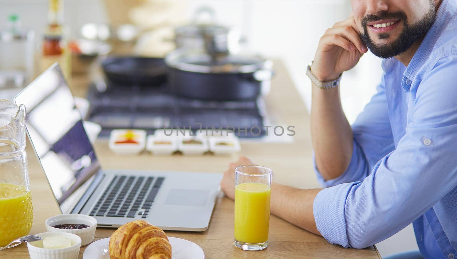 Man preparing delicious and healthy food in the home kitchen by lenets