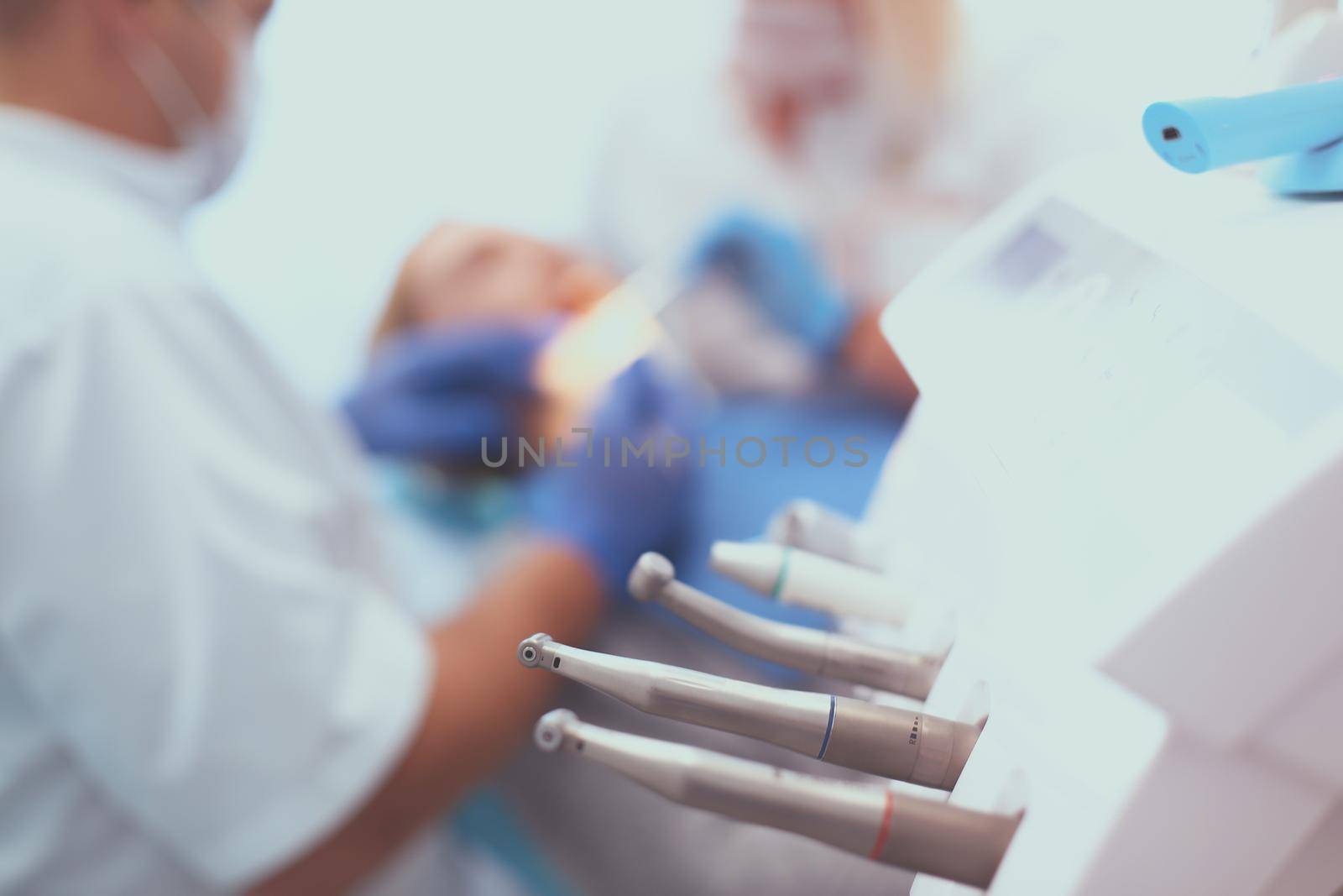 Different dental instruments and tools in a dentists office by lenets