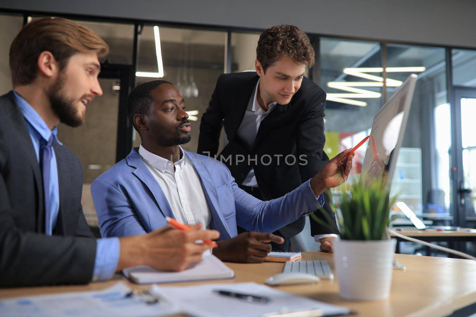 Group of business people in a meeting discussing and planning a project