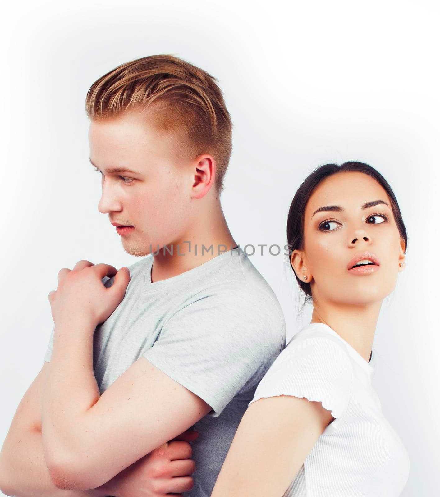 modern hipster guys together couple diverse nations, asian girl and caucasian blond boy isolated on white background, lifestyle people concept close up