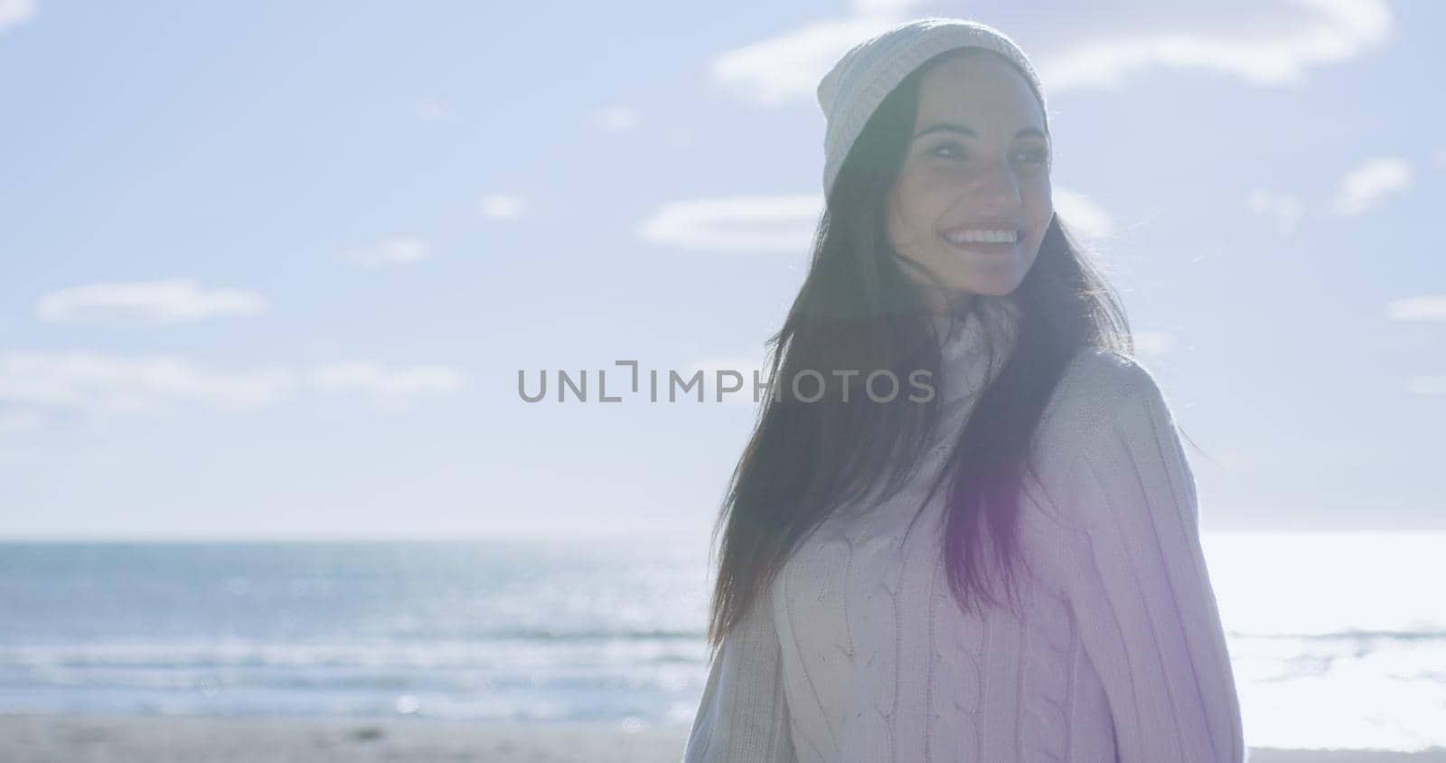 Girl In Autumn Clothes Smiling on beach by dotshock