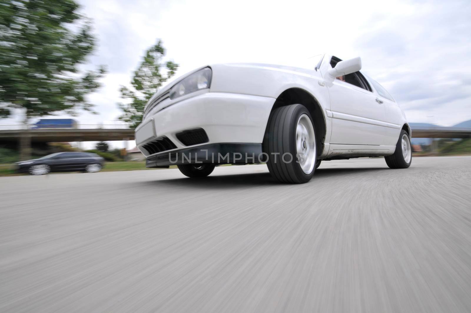 Fast car moving with motion blur by dotshock