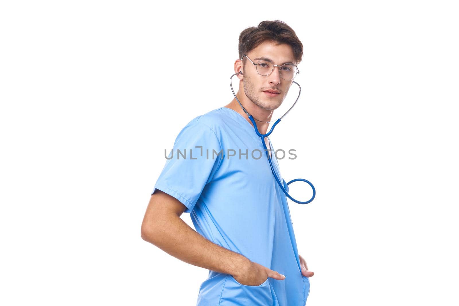 man in medical uniform health care treatment stethoscope examination studio lifestyle. High quality photo
