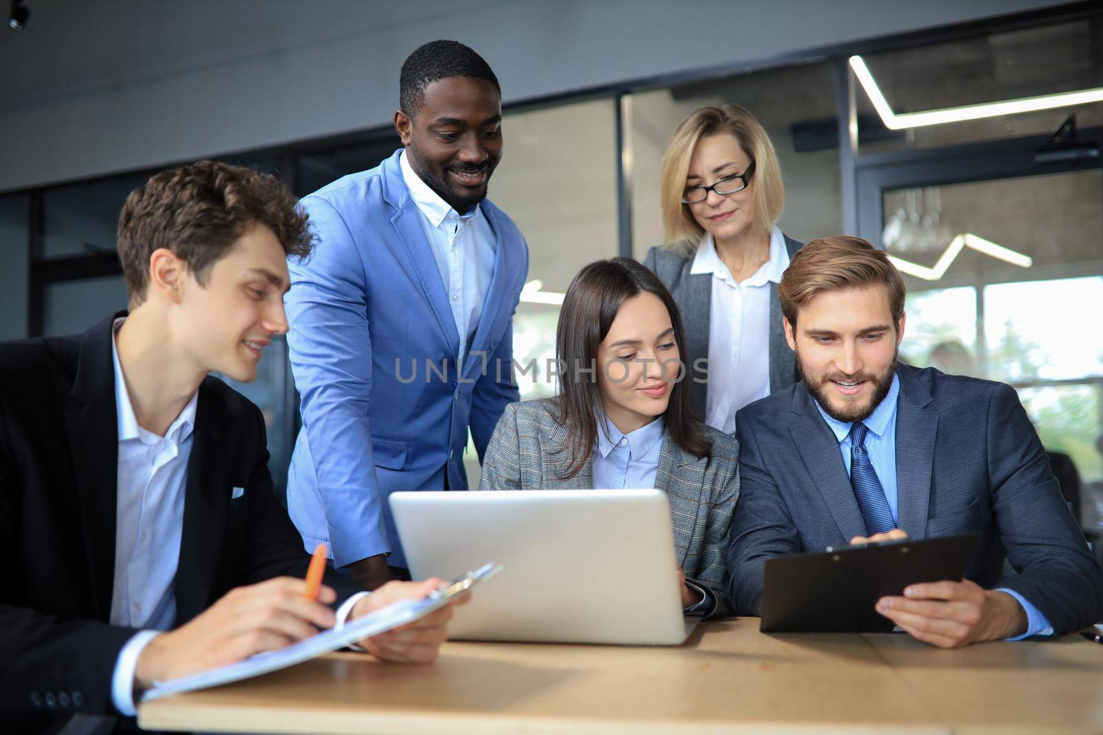 Business meeting - manager discussing work with his colleagues