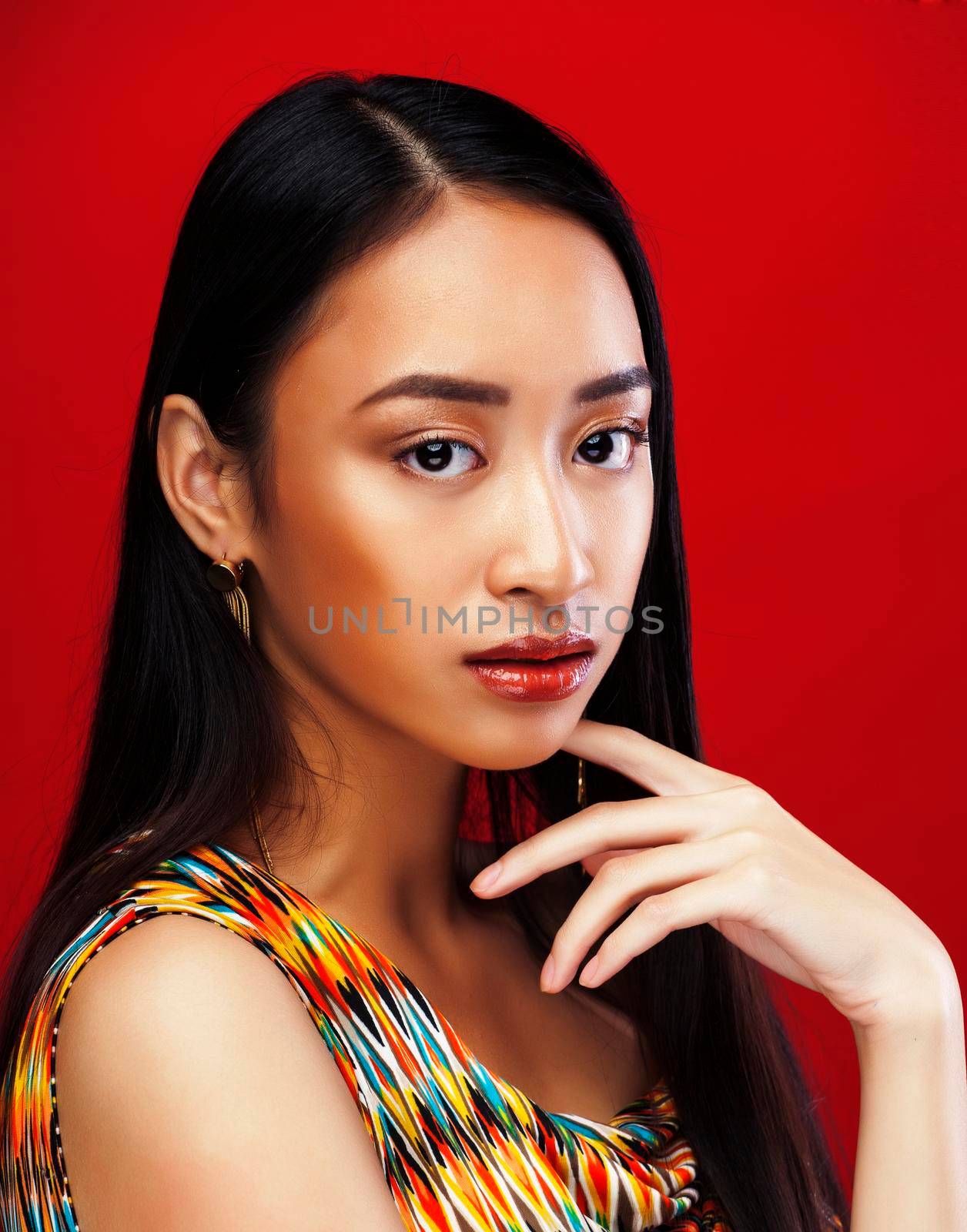 beauty young asian girl with fashion make up on red background , beauty stylish look close up