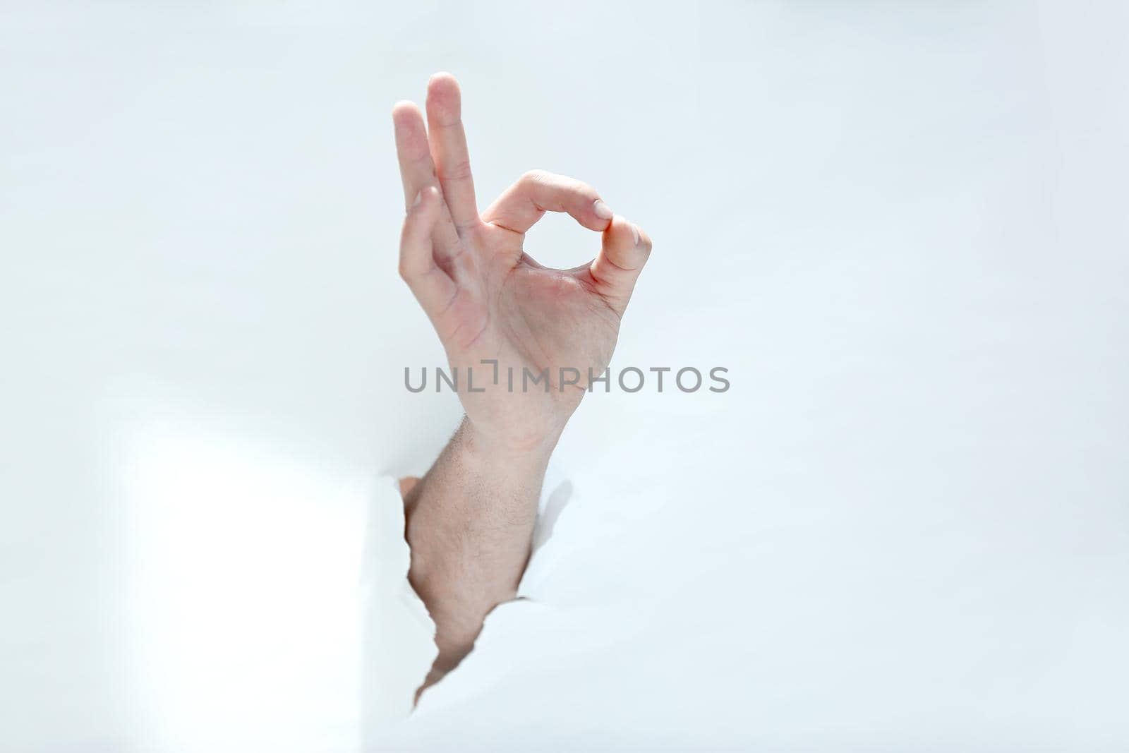 hand showing the OK gesture .photo with copy space