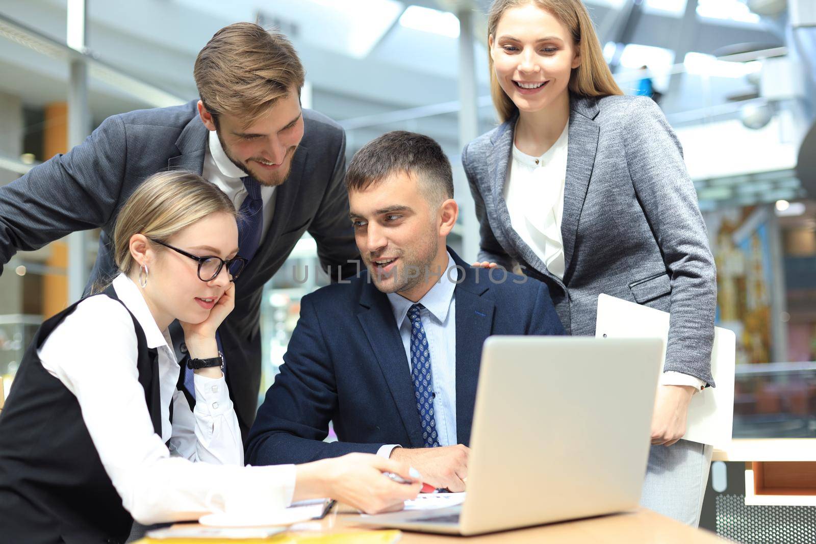 business team working on laptop to check the results of their work