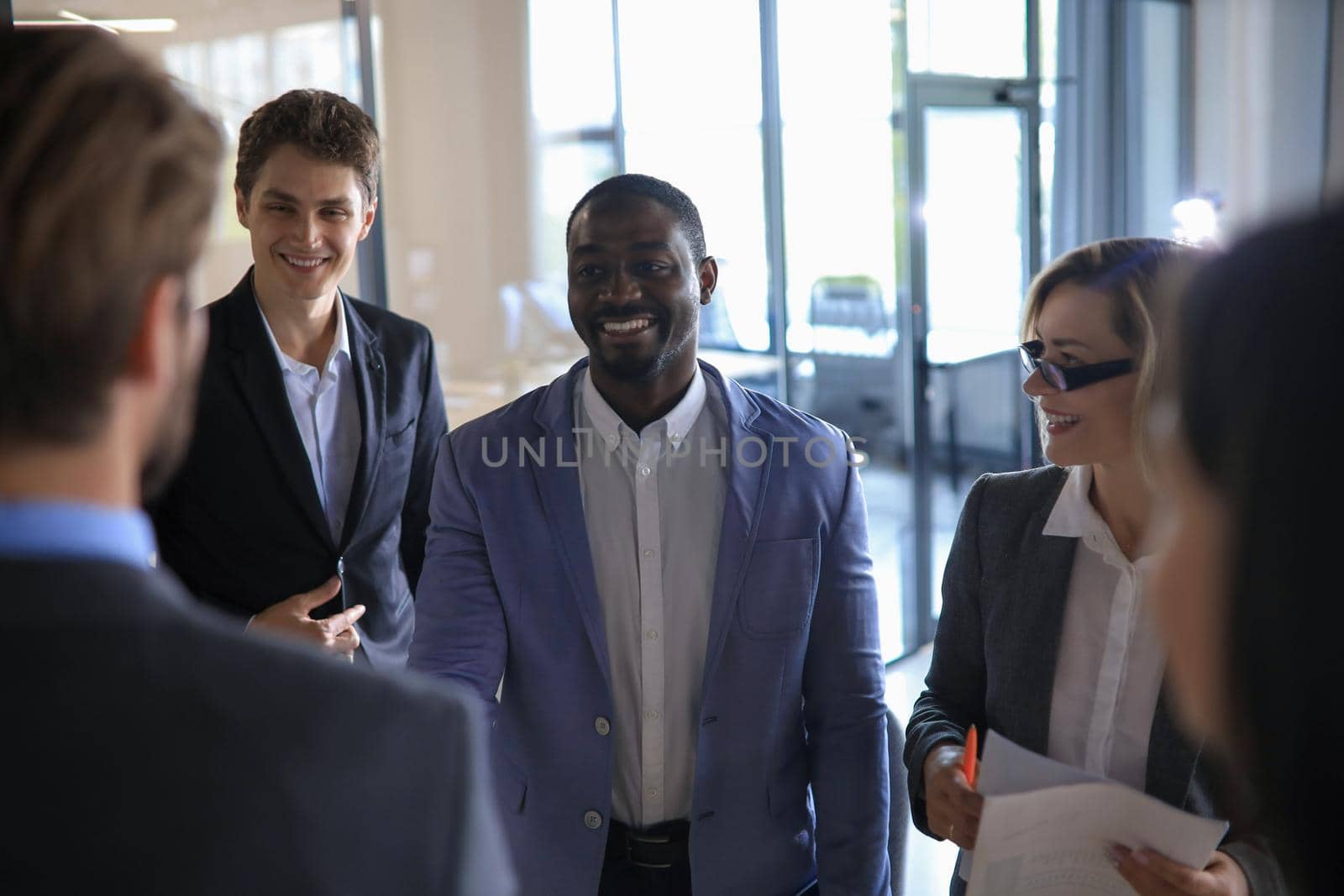 happy young businessman shaking hands with his business partner.