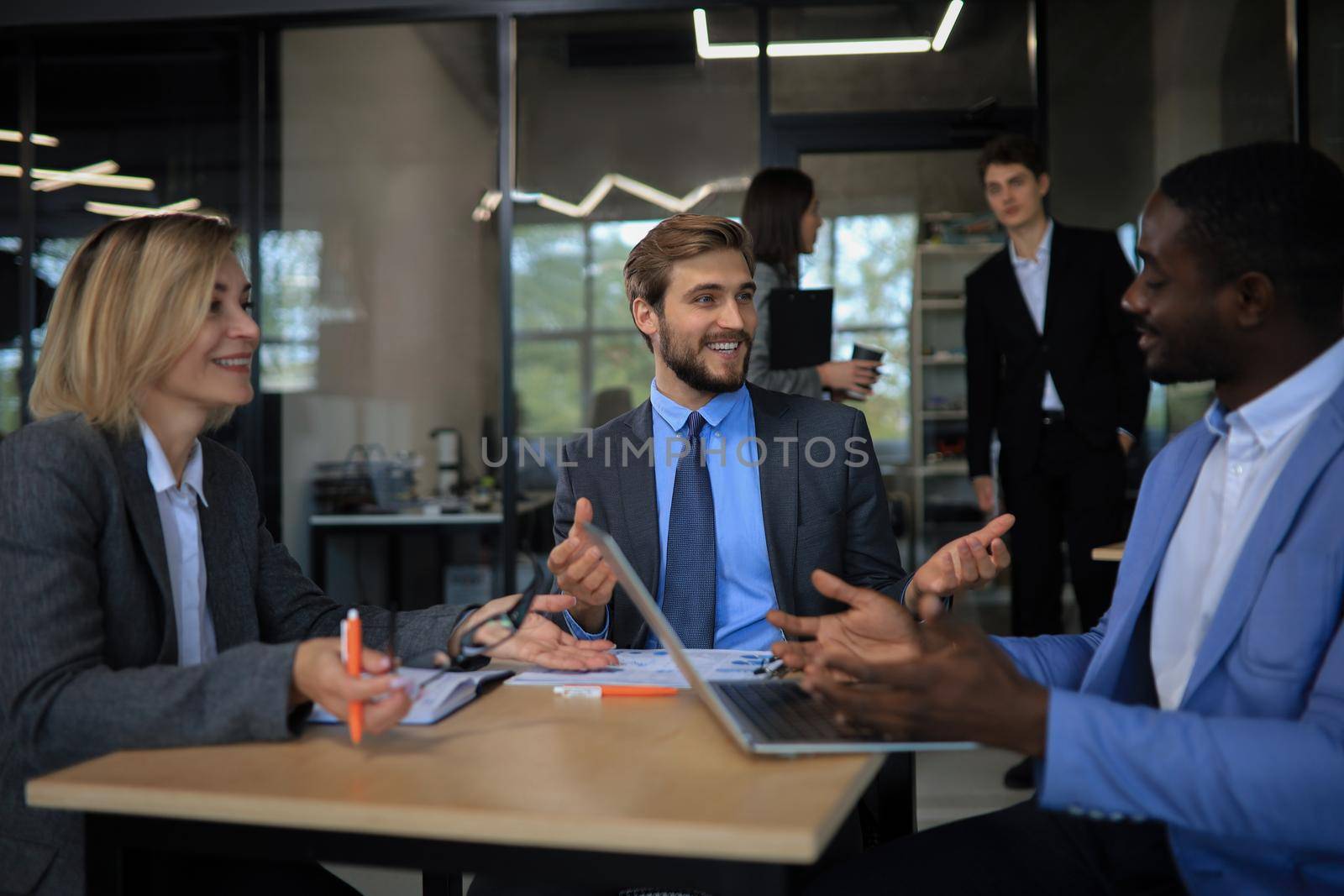 Modern business people discuss the new project at office