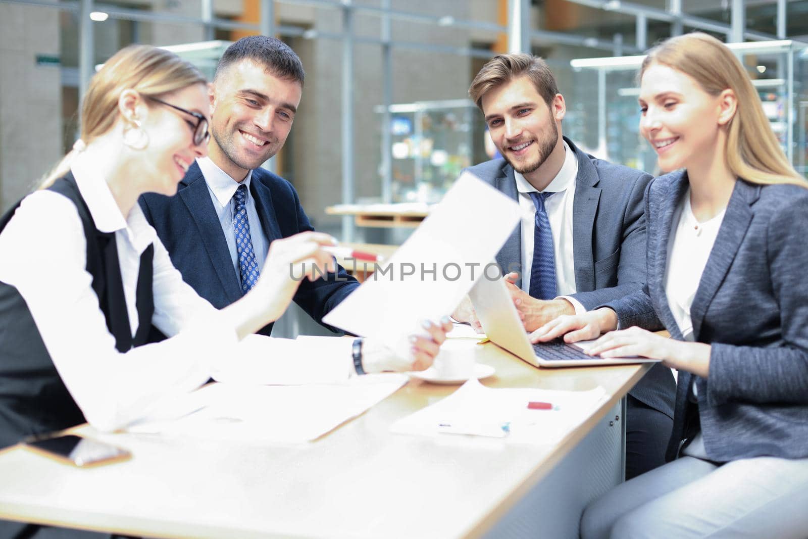 Group of business partners discussing ideas and planning work in office