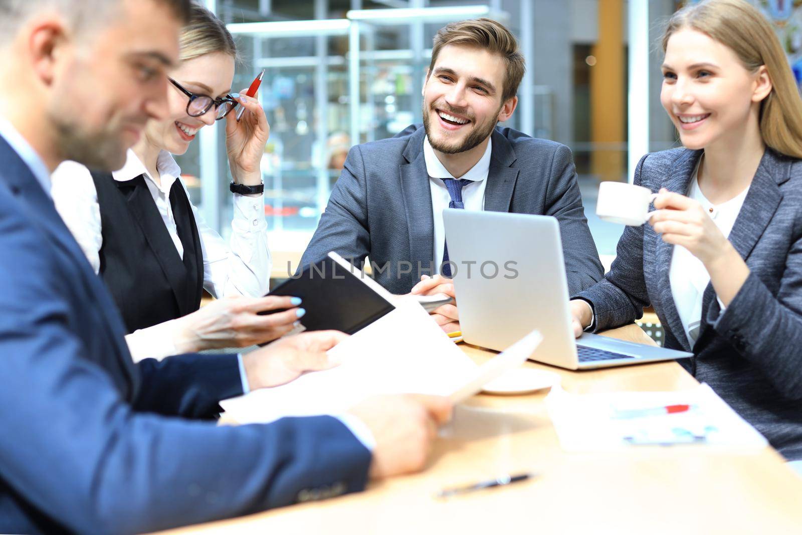 Group of business partners discussing ideas and planning work in office