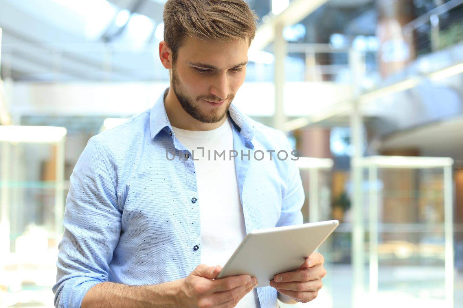 Businessman using his tablet in the office