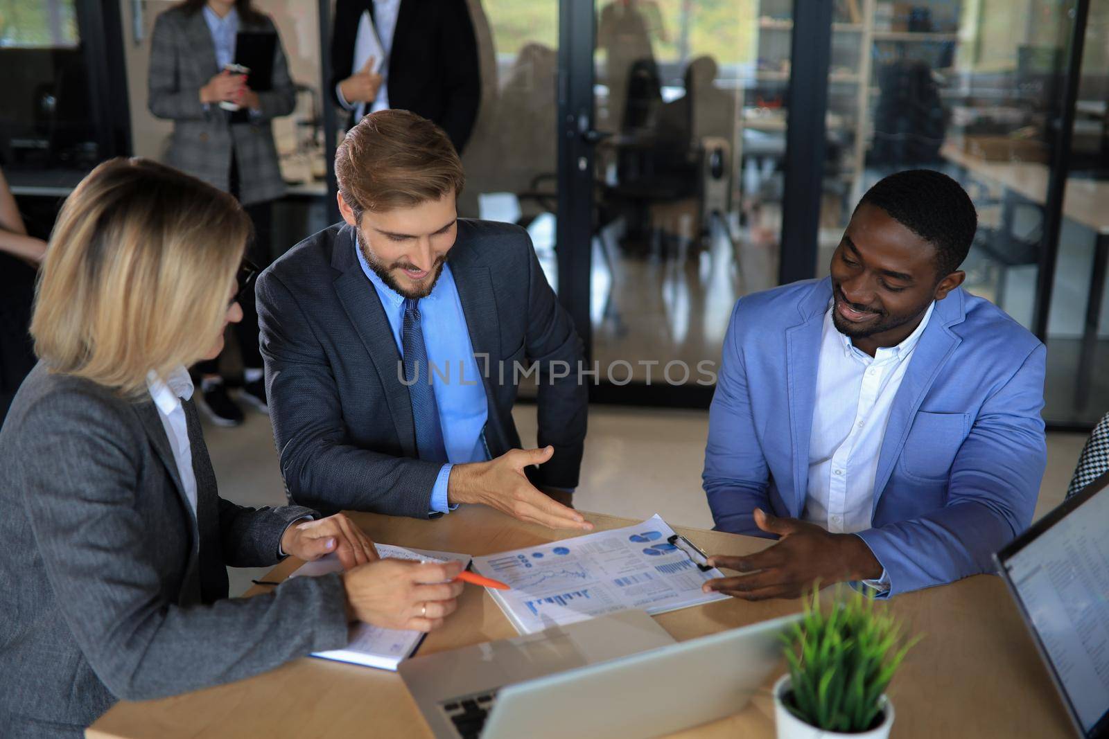 Group of business people in a meeting discussing and planning a project