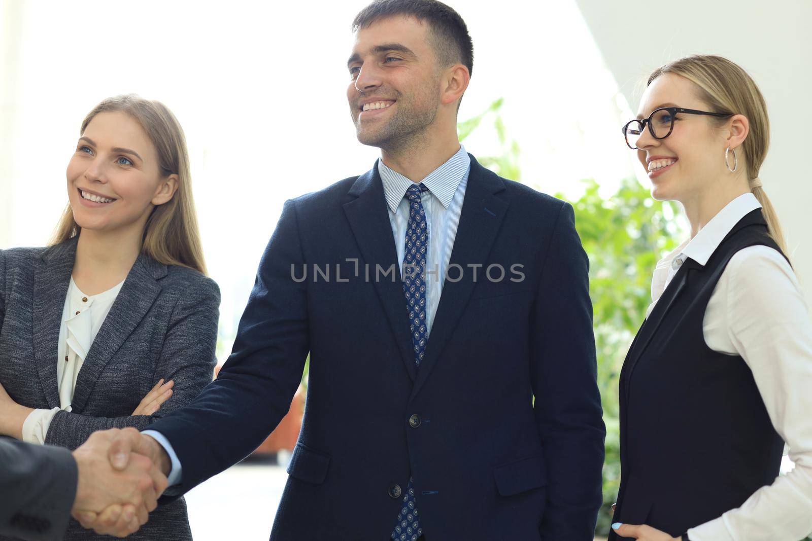 Business people shaking hands, finishing up a meeting