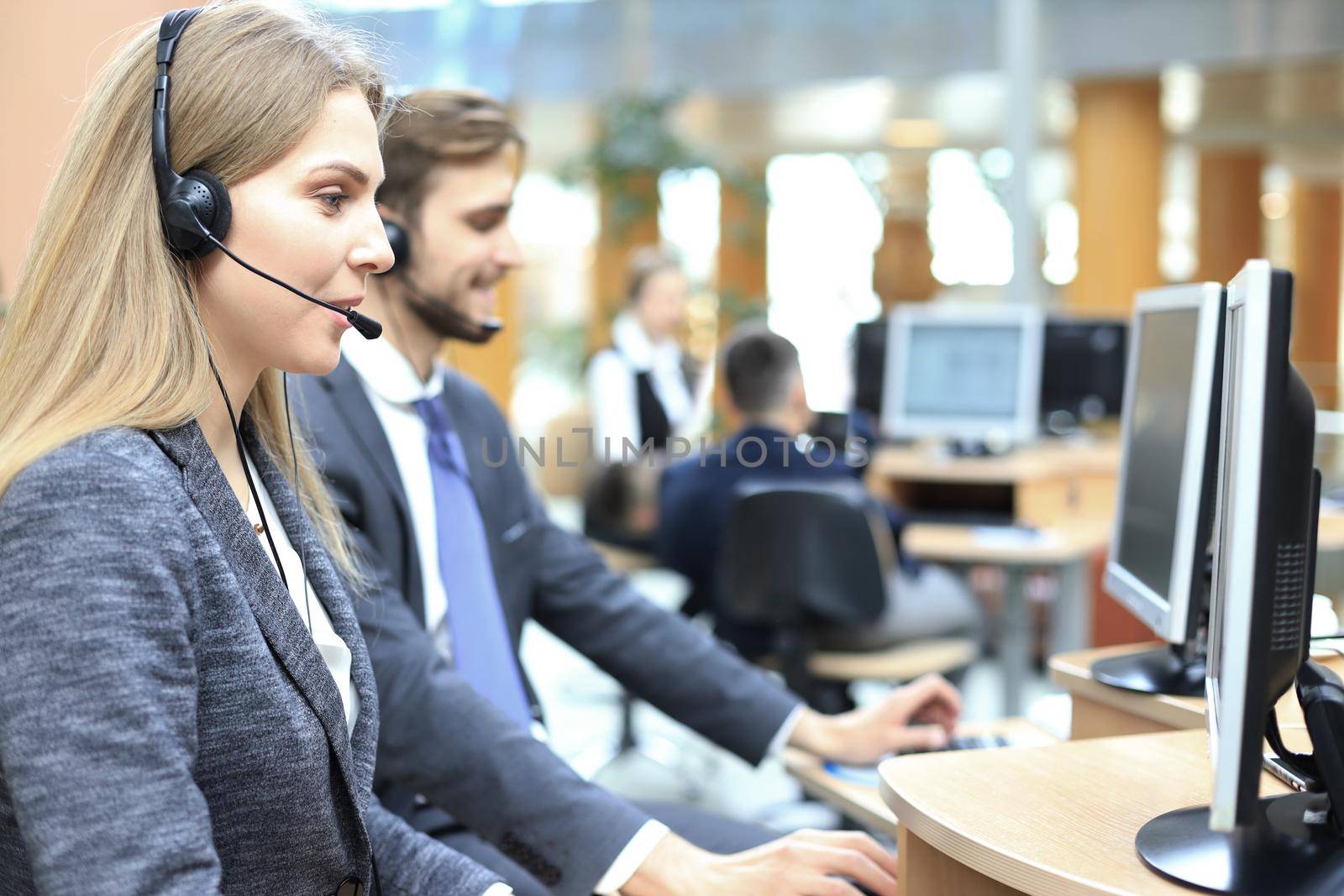 Female customer support operator with headset and smiling