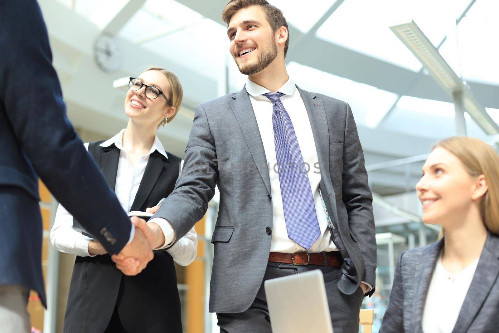 Business people shaking hands, finishing up a meeting