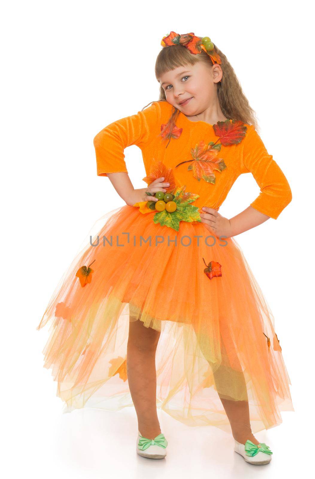 Nice little girl dressed in a bright orange dress- Isolated on white background