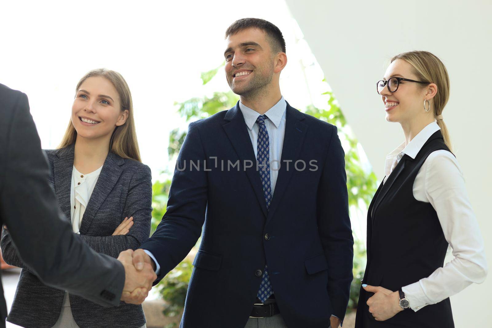 Business people shaking hands, finishing up a meeting