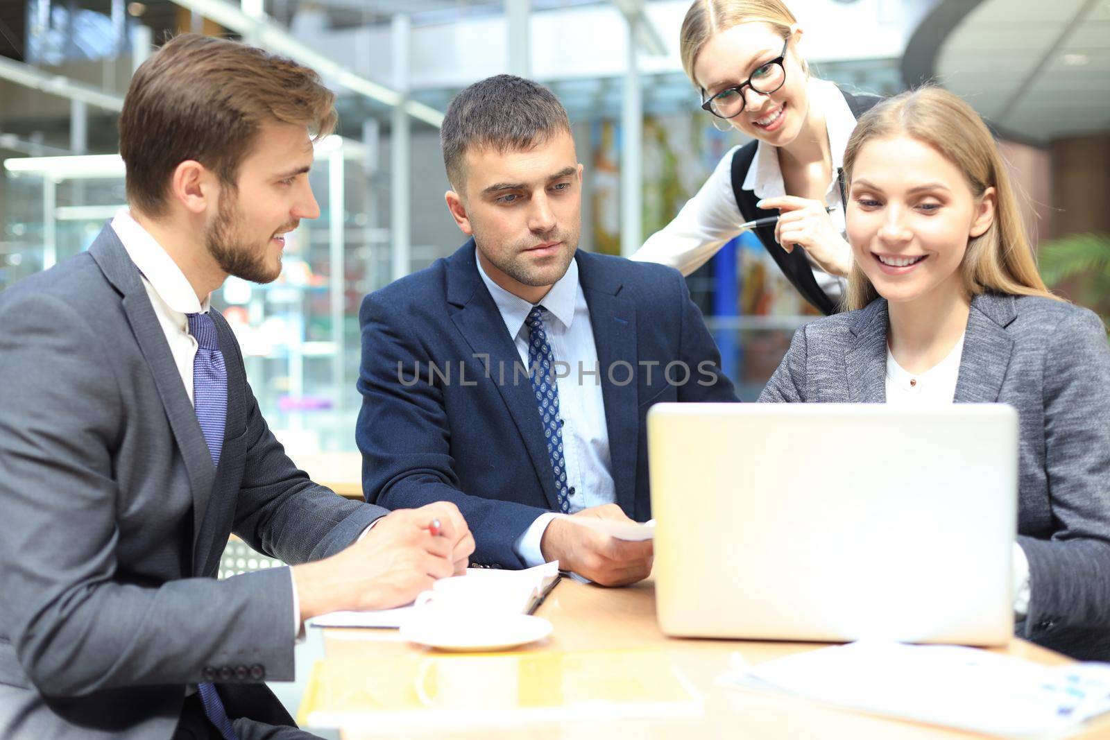 business team working on laptop to check the results of their work