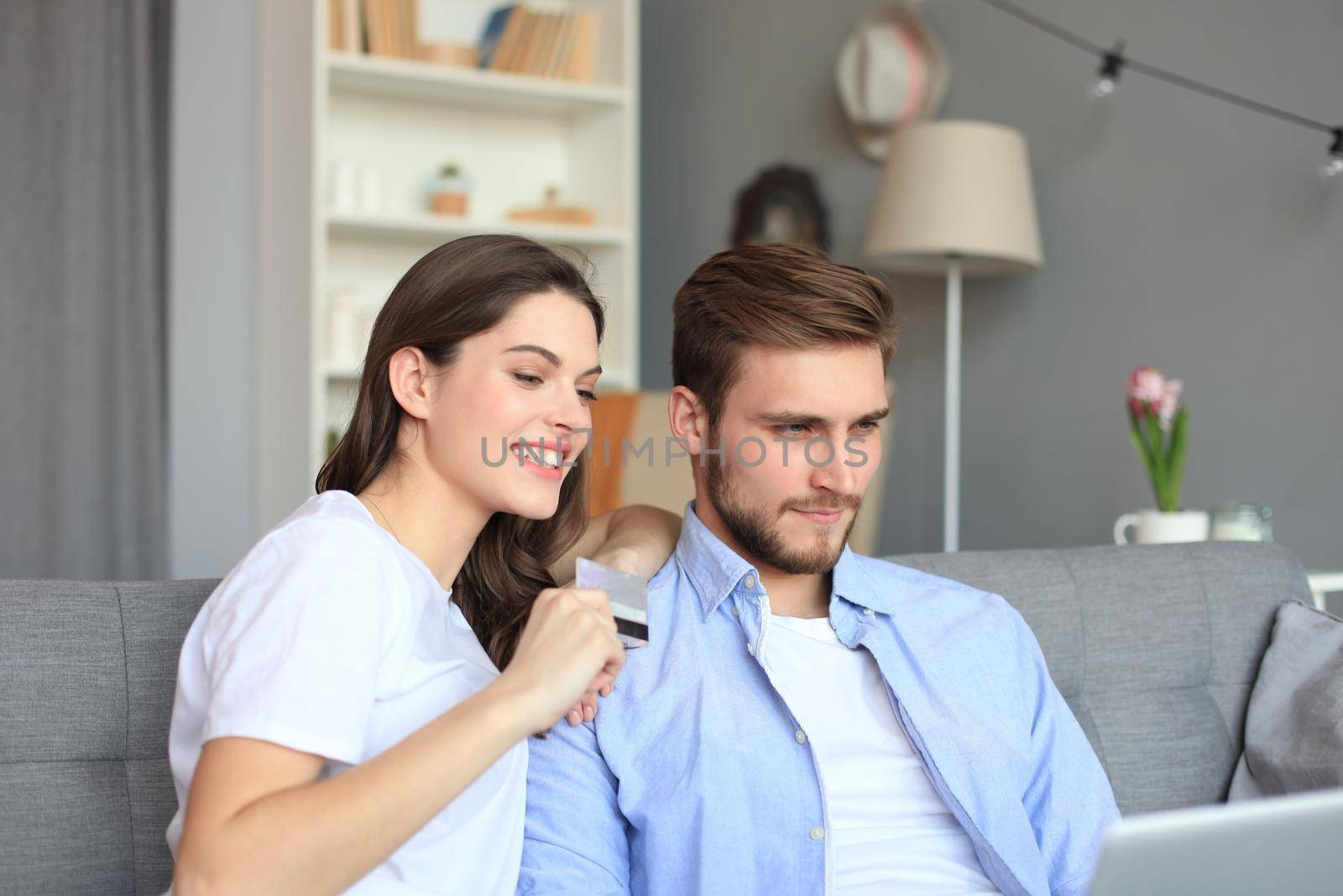 Young couple doing some online shopping at home