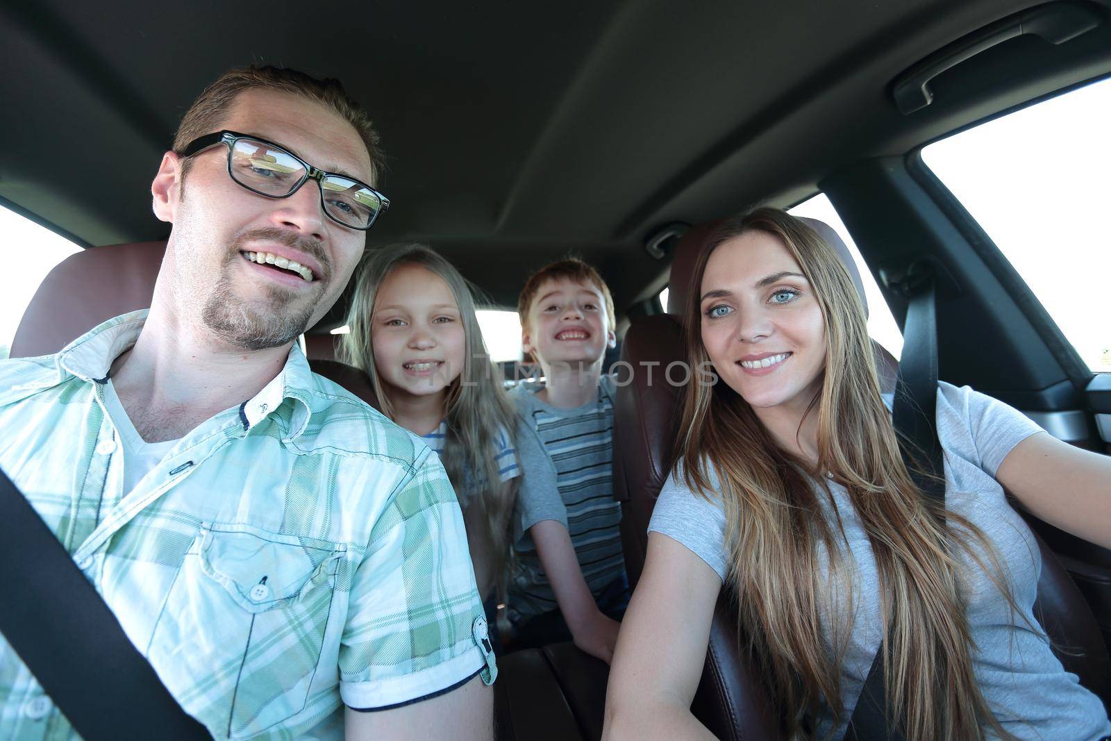 close up. happy family in a comfortable car by asdf